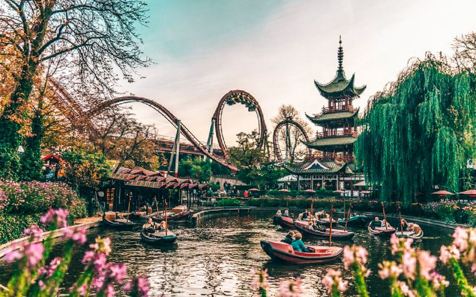 What are the best times to visit Tivoli Gardens in Copenhagen, Denmark